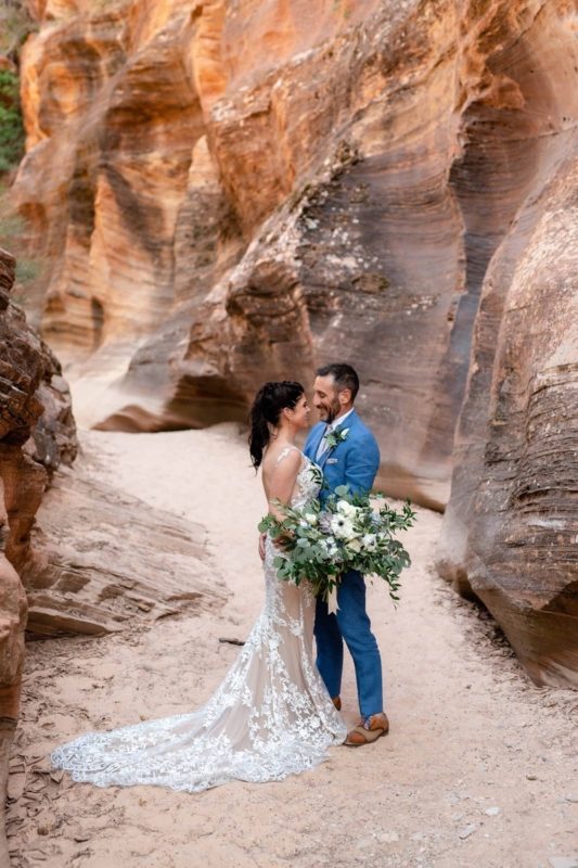Destination-Zion-national-park-elopement-bride-grooslot-canyon-kyle-loves-tori-elope-adventure-red-rock-wedding-intimate-ceremony