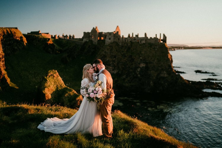 Dunluce+Castle+Elopement-nigel-ivy-elopement-videographer-ireland-elope-wedding-couple-coast-antrim-cliff